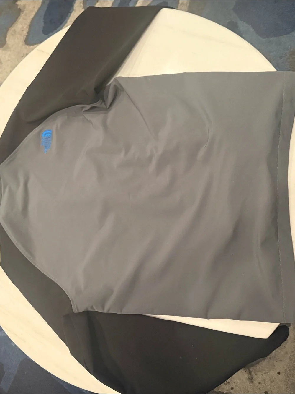 The North Face Men’s Gray Softshell Jacket with Black Sleeves and Blue Trim